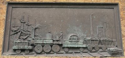 Sailing ship, iron works and a very early locomotive hauling wagons of coal or iron ore etc.