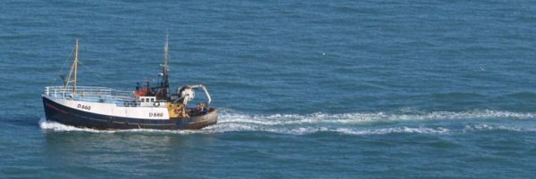 Fishing boat returning to Howth harbour.
