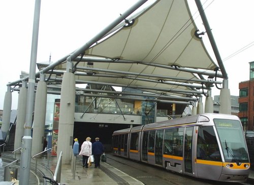 The Luas or Tram system departing from the avante-garde cover in Connelly Station.