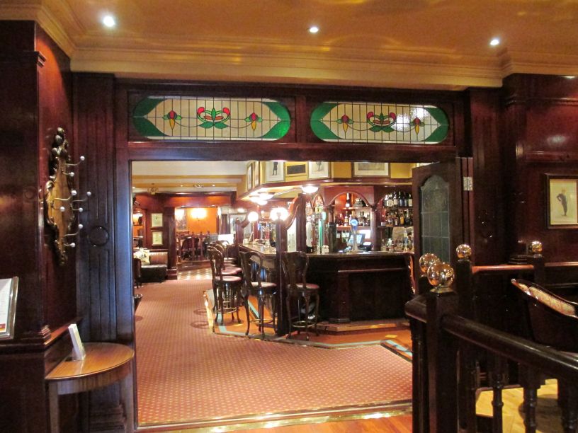 The lovely old-fashioned interior of one of the bars in the Granville Hotel, Waterford, good food too further along on the right!