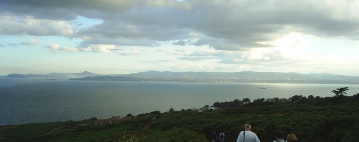 The 'jolly band' looking across Dublin Bay to the sunset over the Wicklow Mountains on the beautiful Howth Cliff walk north of Dublin City. The 'jolly band' looking across Dublin Bay to the sunset over the Wicklow Mountains on the beautiful Howth Cliff walk north of Dublin City.