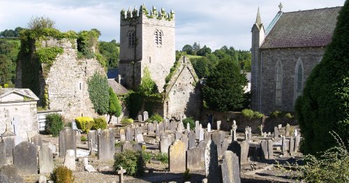 On the left, St Mary's and the Catholic Church of St. Columcille on the right. - Inistioge, County Kilkenny, Ireland