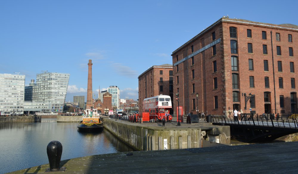 Canning Half Tide Dock (built by Hartley 1842-4) with the entrance to the Albert Dock on the right, the Pump House in the middle, now refurbished as a pub. Liverpool's historic docks England