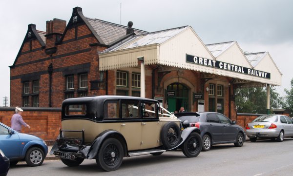 The entrance to Loughborough Central station (built 1898), with a car waiting for some newly weds of on a train trip - The Great Central Railway, England, English Midlands
