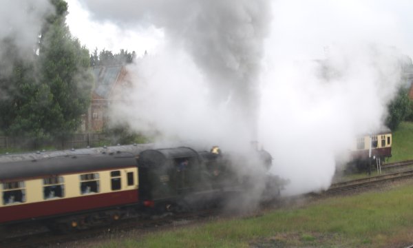 Ex GWR 2-6-2 prairie tank engine 4141 finally departing from Loughborough Central station with a train bound for Leicester North Station - The Great Central Railway, England, English Midlands