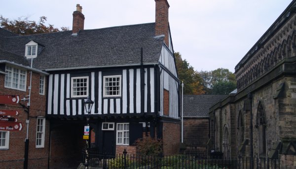 he beautifully carved stonework of the north wall of the medieval church of St Mary de Castro and adjoining timbered gatehouse of 1445 in the City of Leicester