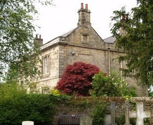 A fine house next to St Cuthbert's Church in Beltingham.