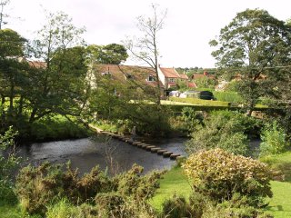 The stepping stones across the River Esk - Lealholm Village, North York Moors National Park, North Yorkshire, England
