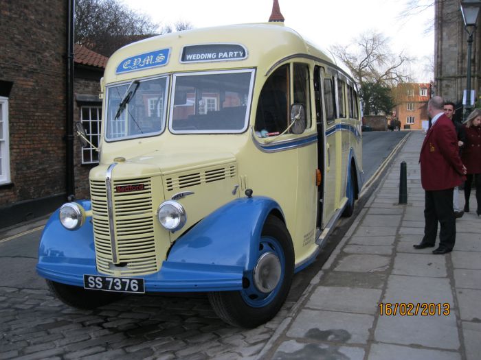 Registration number for the vehicle SS 7376, an old coach, used in this case for a wedding party. It is a 1949 Bedford OB duple bus