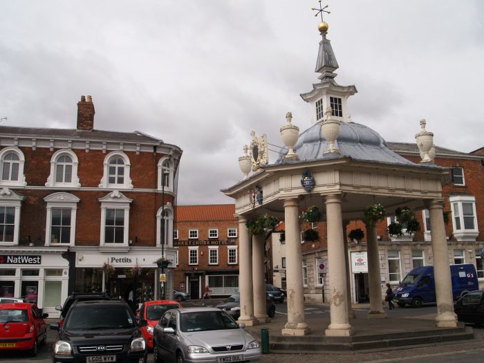 Beverley Town Centre: The Market Cross, square with canted corners and eight Tuscan columns supporting four diagonals in pairs.