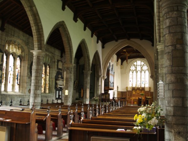 Much of the present church dates from the 18th century (~1721), but the lower parts of the north wall and the tower date from the early 16th century.