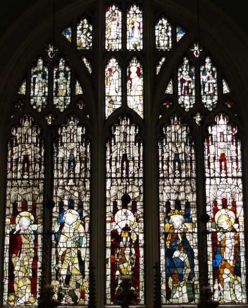 The medieval stained glass in the east window of St Olave's Church.