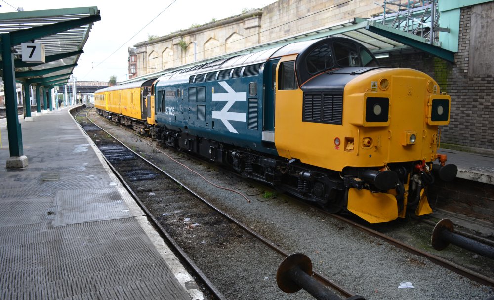 Portrait of Class 37/0 37025 Inverness TMD in Carlisle station at the rear of the same Network Rail test train as above. Class 37 diesel locomotive 37025 entered service in 1961 as D6725 and is now operated by Colas Rail