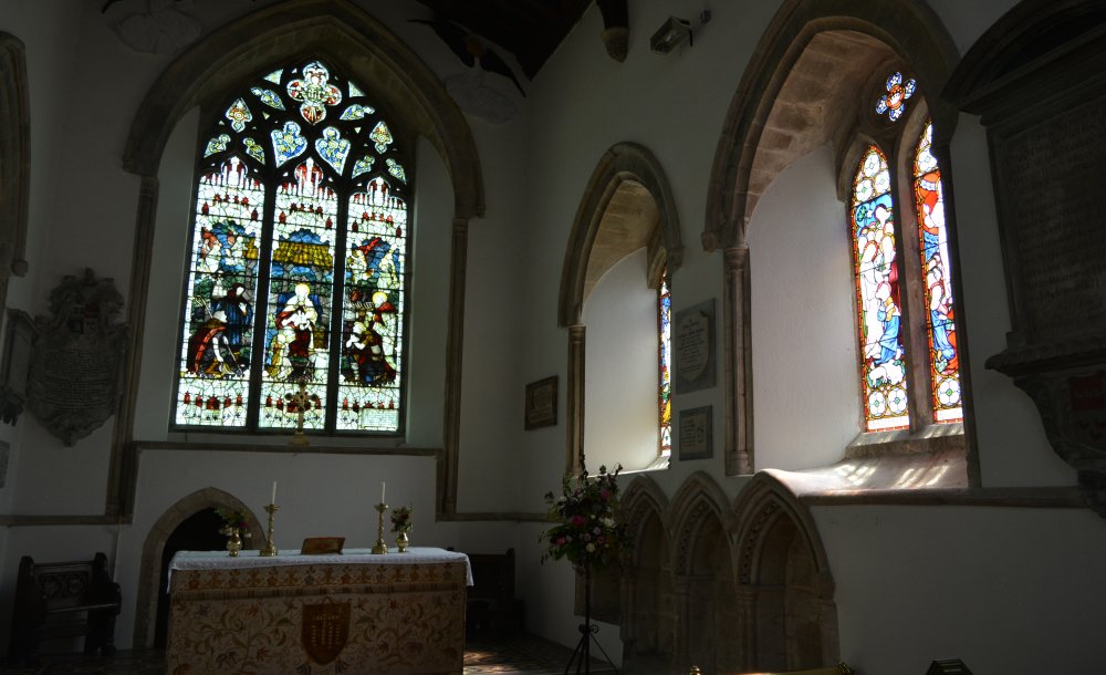 stained glass windows and altar in the chancel of Church of St Michael and All Angels Hallaton - Horninghold circular walk, Leicestershire