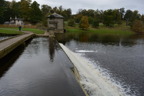 footbridge crossing by the Fishing Tabernacles Studley Royal walks park gardens in Autumn