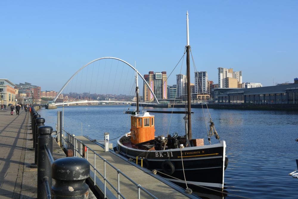 old restored fishing boat tied up at the Quayside between the Tyne Bridge and Millenium Bridge