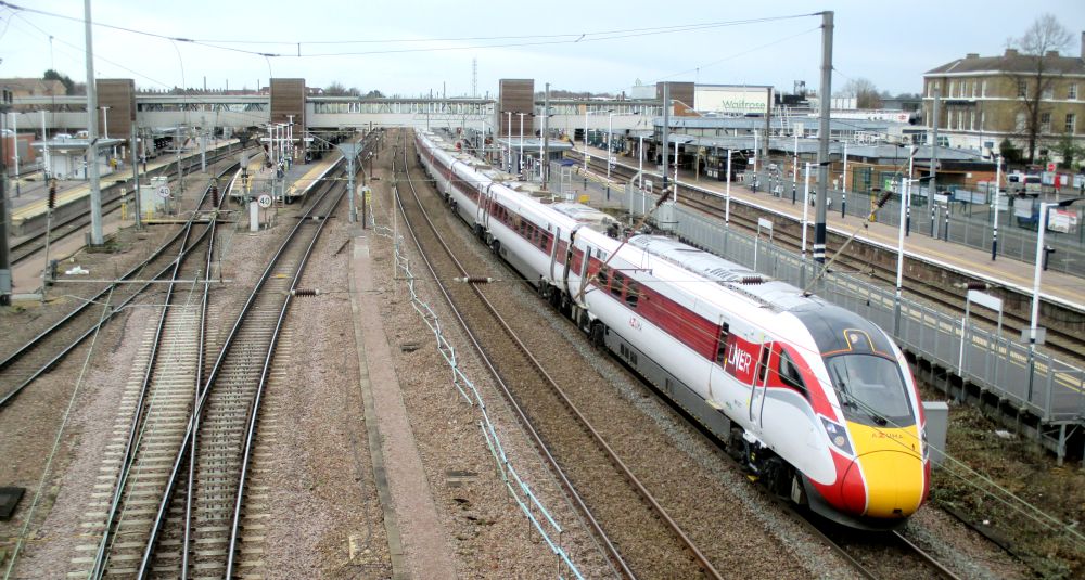 Class 801 EMU leaving Peterborough station with an LNER Azuma service from Leeds to London Kings Cross
