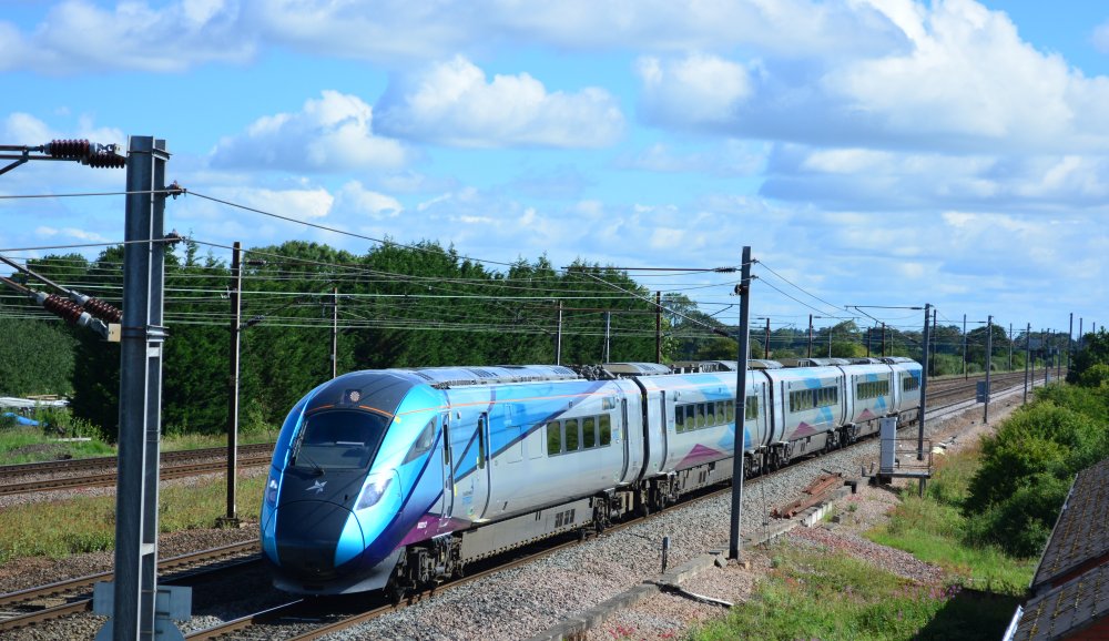 Class 802 bi-mode 802212 with the TransPennine 0843 service from Newcastle to Liverpool Lime Street trainspotting Colton Junction footbridge