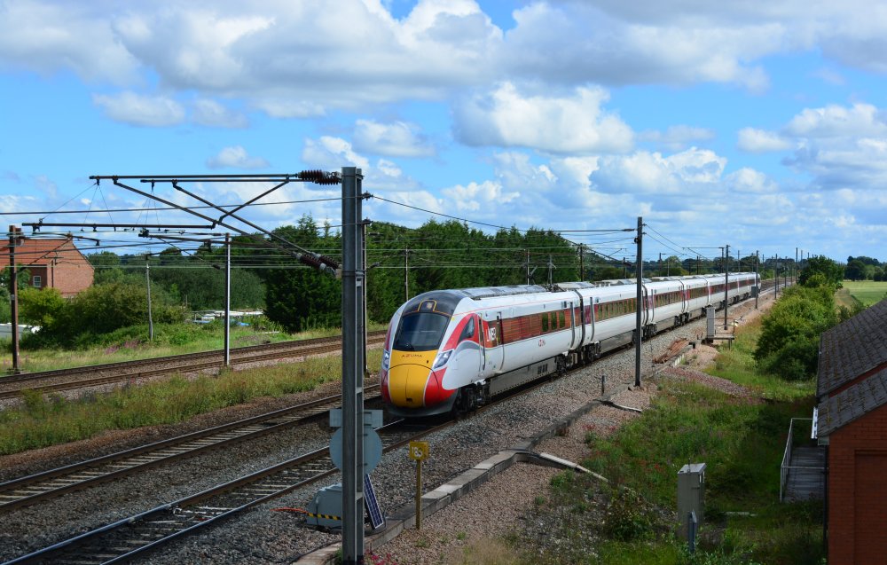 Class 801 EMU 801216 with the 0648 LNER Azuma service from Glasgow Central to London Kings Cross trainspotting Colton Junction footbridge