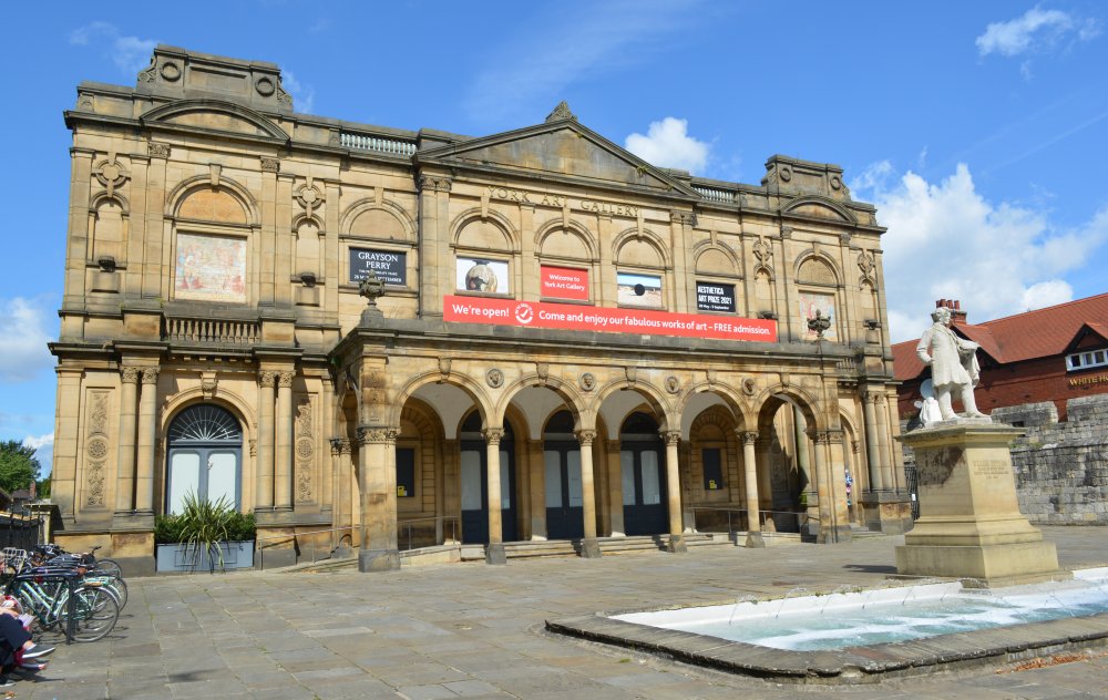 The entrance and facade of York Art Gallery, fountain and statue of the artist William Etty in Exhibition Square.