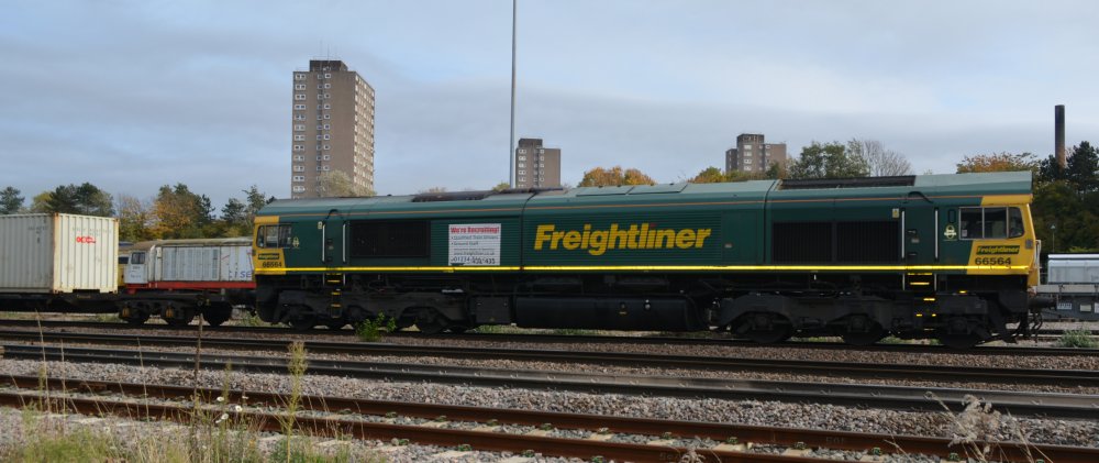 Freightliner EMD Class 66/5 diesel 66564 passing the Leicester yard of UK Rail leasing with an intermodal freight train