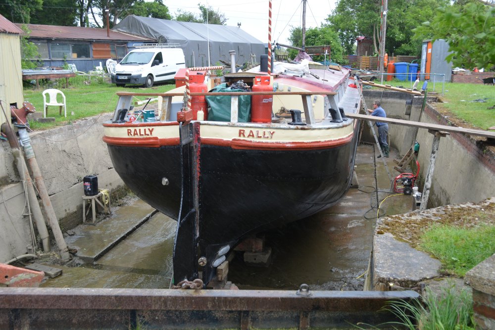 Near Grovehill Lock, the barge RALLY is in a dry dock near the start of the Beverley Beck as it branches off the River Hall Beverley Beck walk Canal Cut