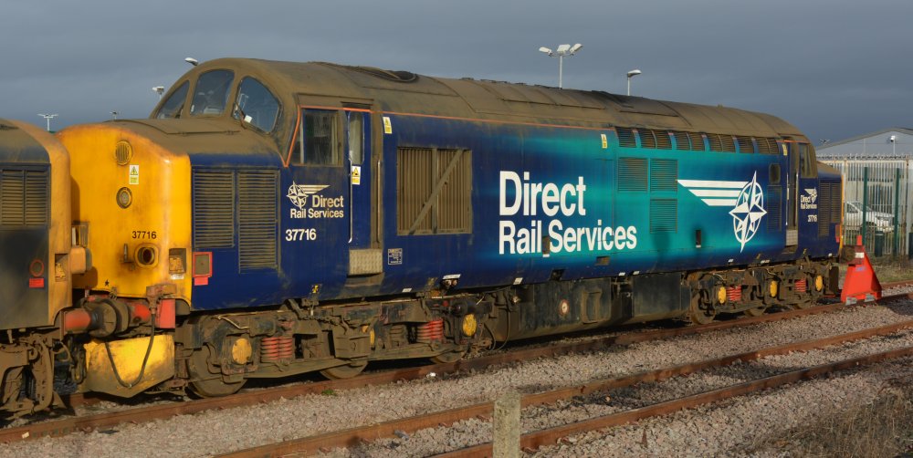 DRS operated diesel-electric locomotive Class 37 37716 parked at York station (January 2023)
