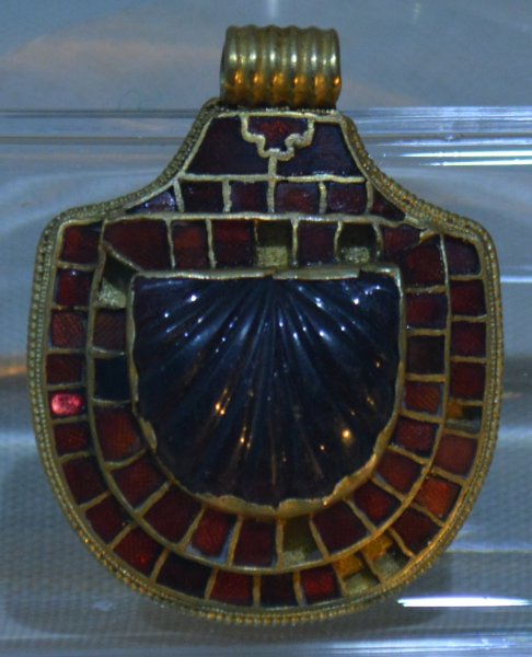 The shield shaped pendant made of gold and 57 inlaid precious red stones from the Anglo Saxon Princess burial Kirkleatham Old Hall Museum and Art Gallery, Cleveland