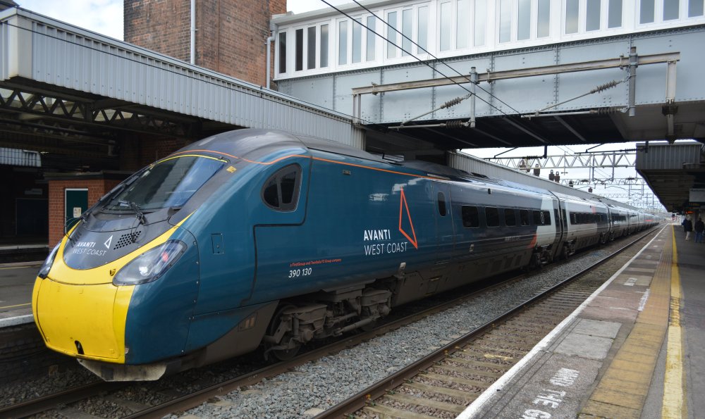 Class 390 express EMU unit 390130 stopping at Nuneaton station with a London Euston to Manchester Piccadilly Avanti West Coast train service (March 2023)