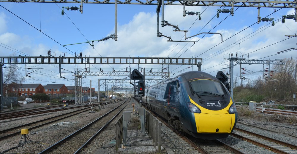 Rear of Class 390 express EMU unit at Nuneaton station with an Avanti West Coast train service from London Euston to Liverpool Lime street station (March 2023).