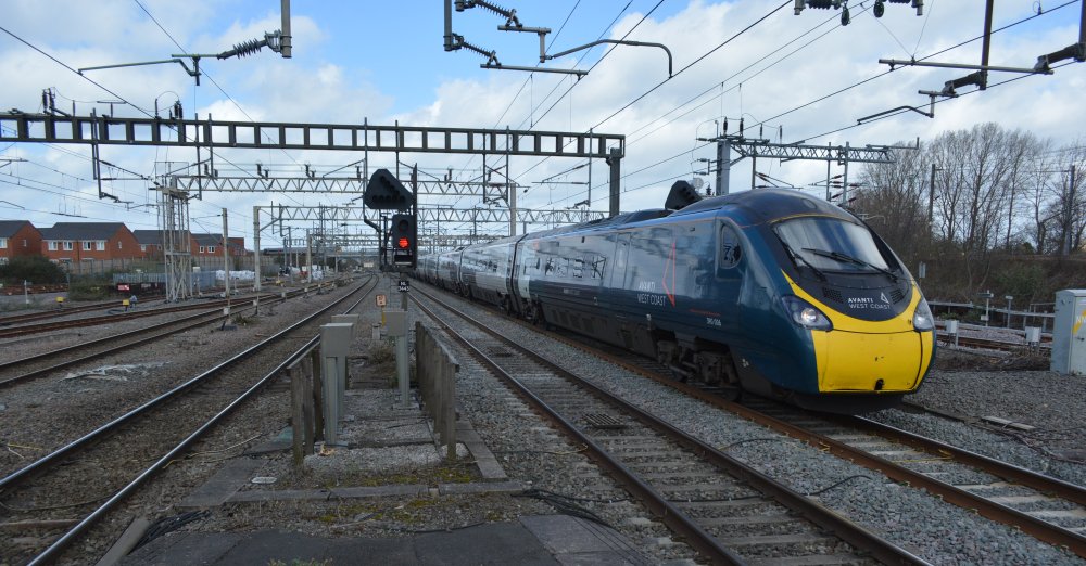 Class 390 express EMU unit 390006 stopping at Nuneaton station with an Avanti West Coast train service from Manchester Piccadilly to London Euston station (March 2023).