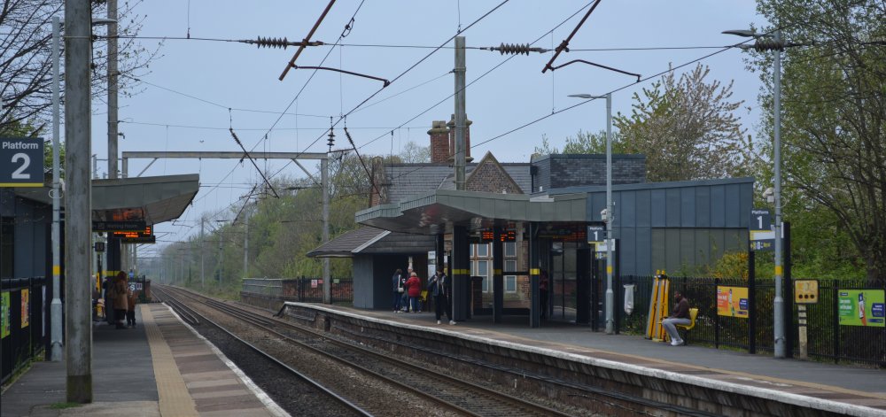 Newton-le-Willows station on the Manchester (platform 1) to Liverpool (platform 2) Line. The service providers are TransPennine, Northern Rail and Transport for Wales (April 2023).
